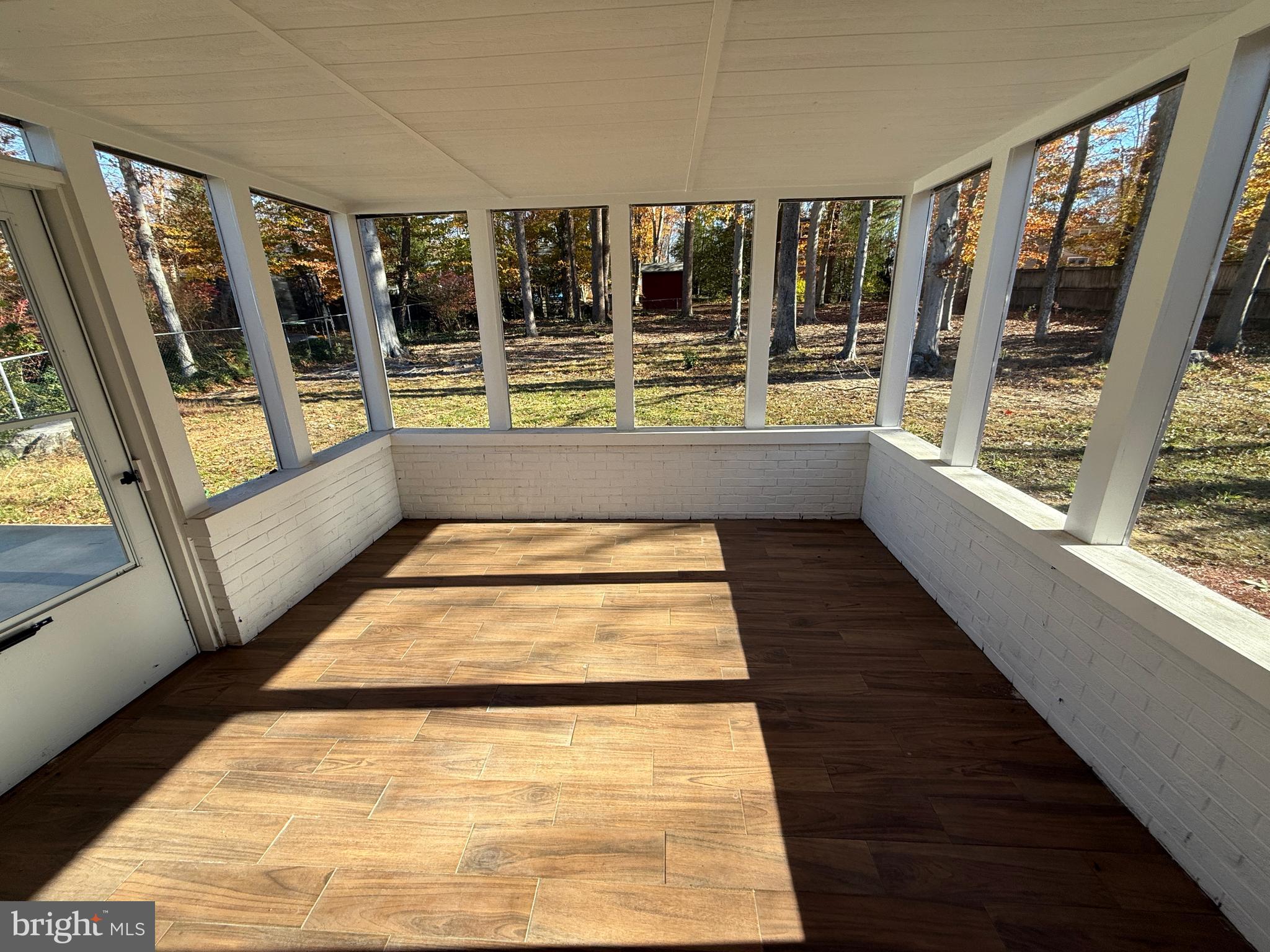 4721 Springbrook Drive Annandale, VA 22003 - Photo 49 of 69 a view of an empty room with wooden floor and a rug