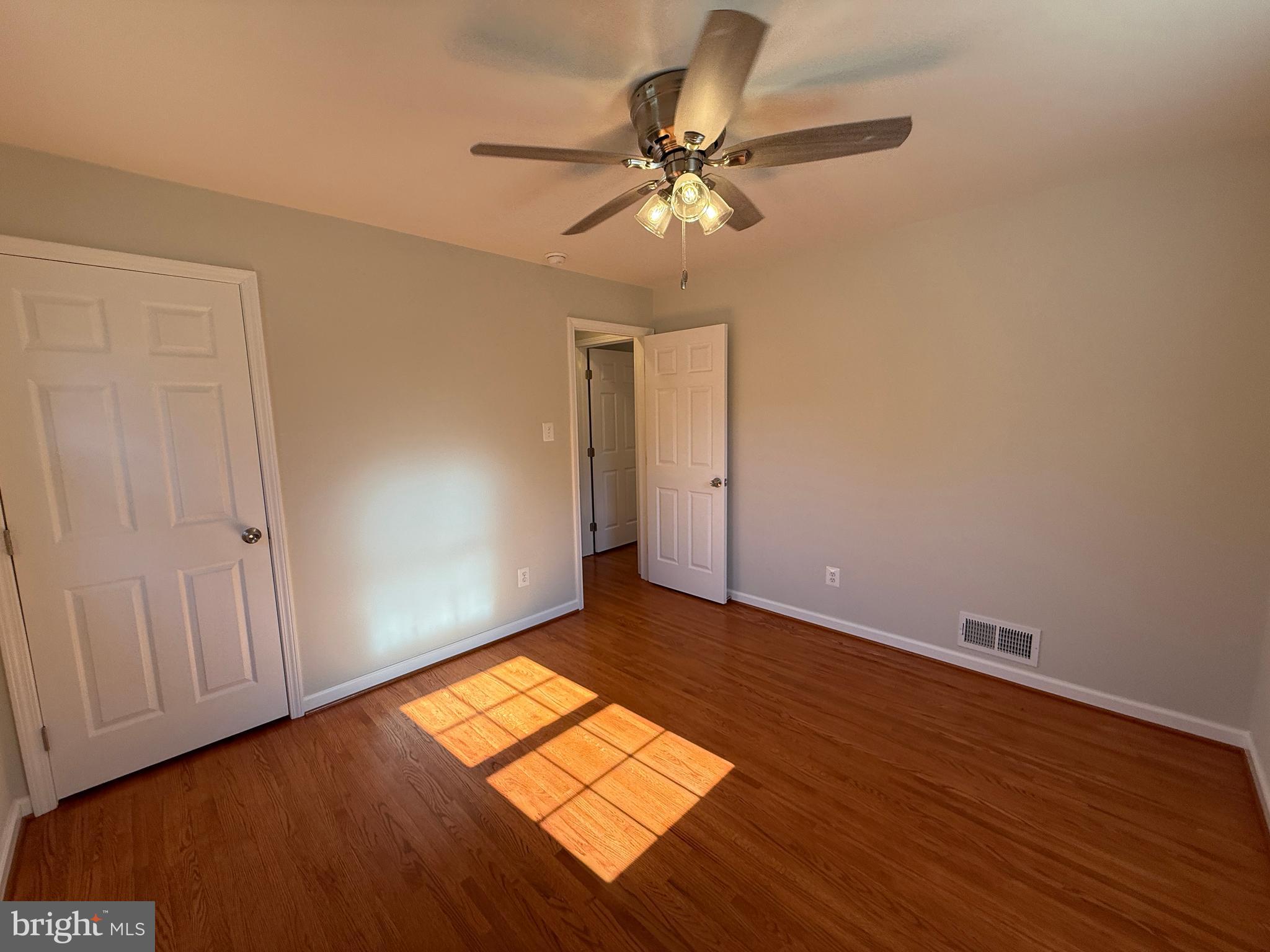 4721 Springbrook Drive Annandale, VA 22003 - Photo 55 of 69 an empty room with wooden floor closet and fan