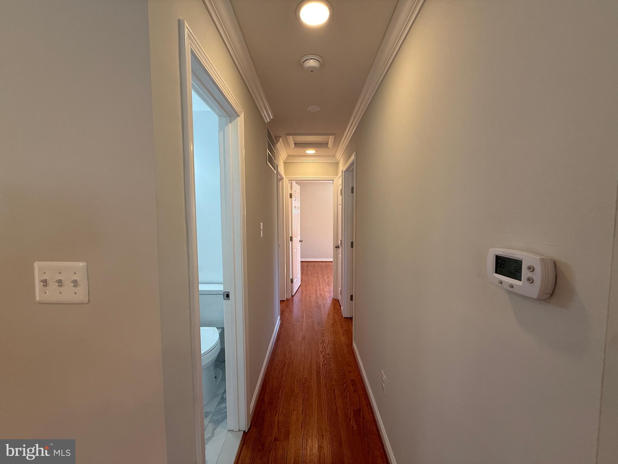 4721 Springbrook Drive Annandale, VA 22003 - Photo 58 of 69 a view of a hallway with wooden floor