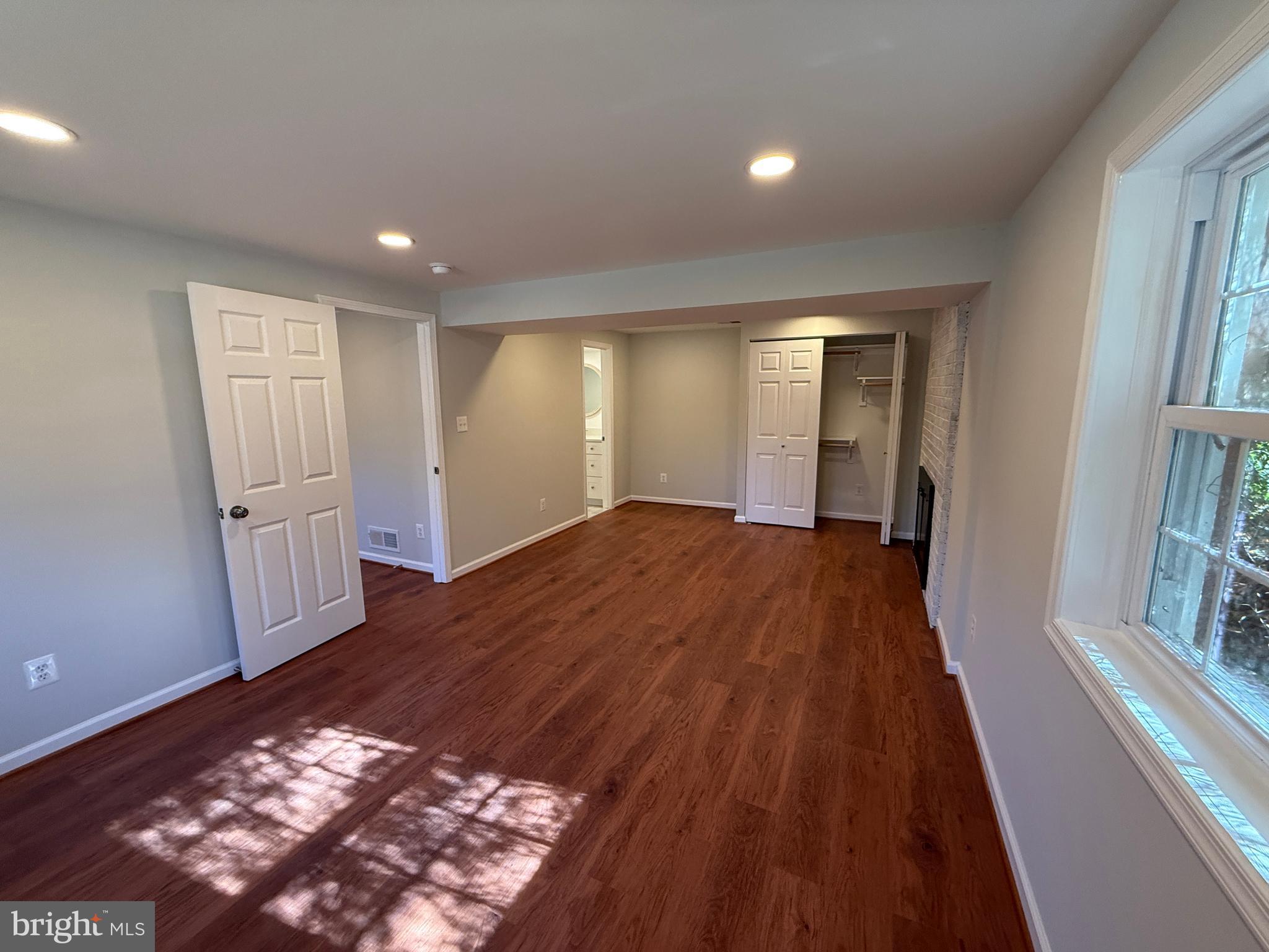 4721 Springbrook Drive Annandale, VA 22003 - Photo 60 of 69 wooden floor in an empty room with a fireplace