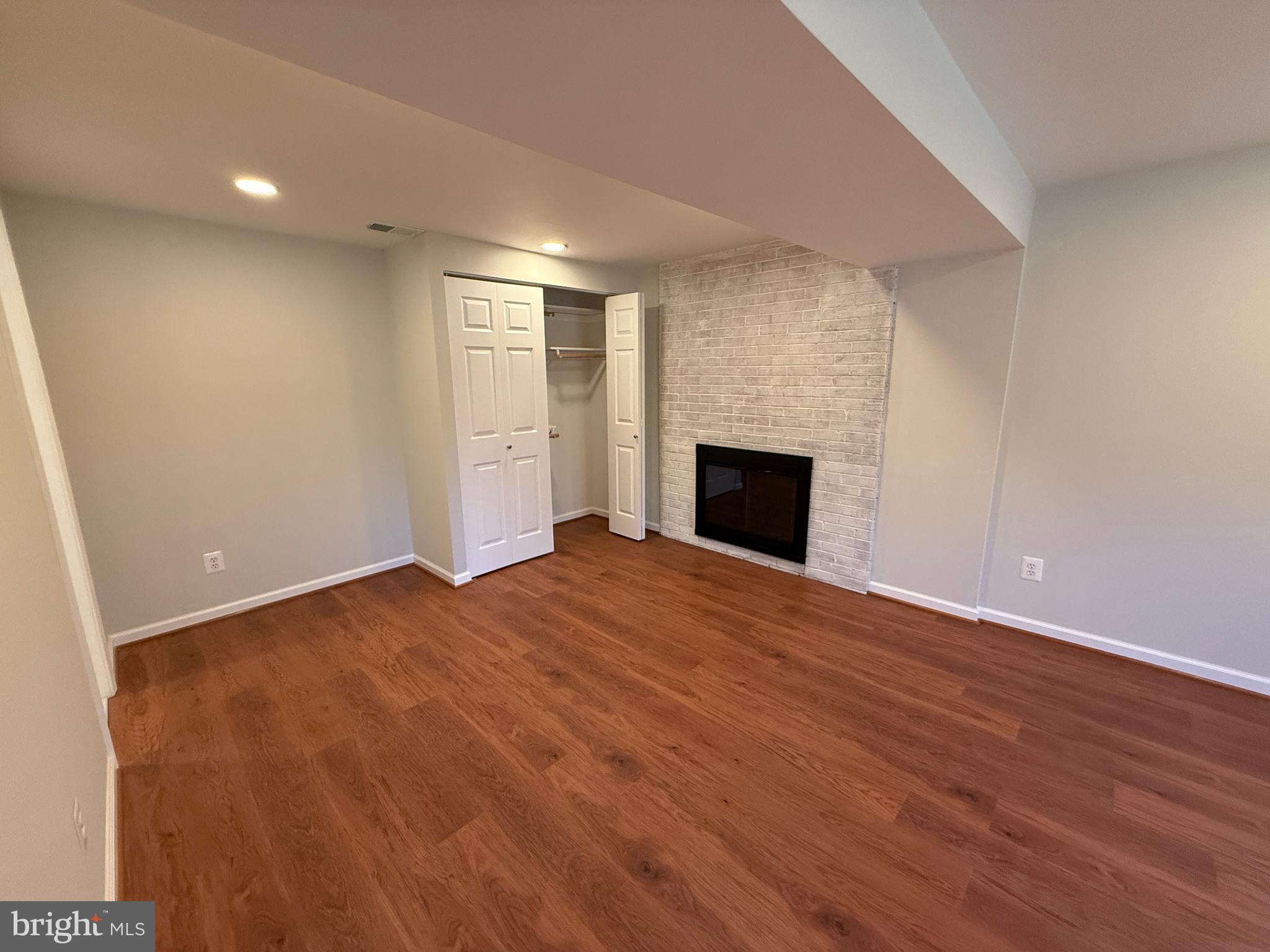 4721 Springbrook Drive Annandale, VA 22003 - Photo 61 of 69 a view of empty room with wooden floor and fireplace