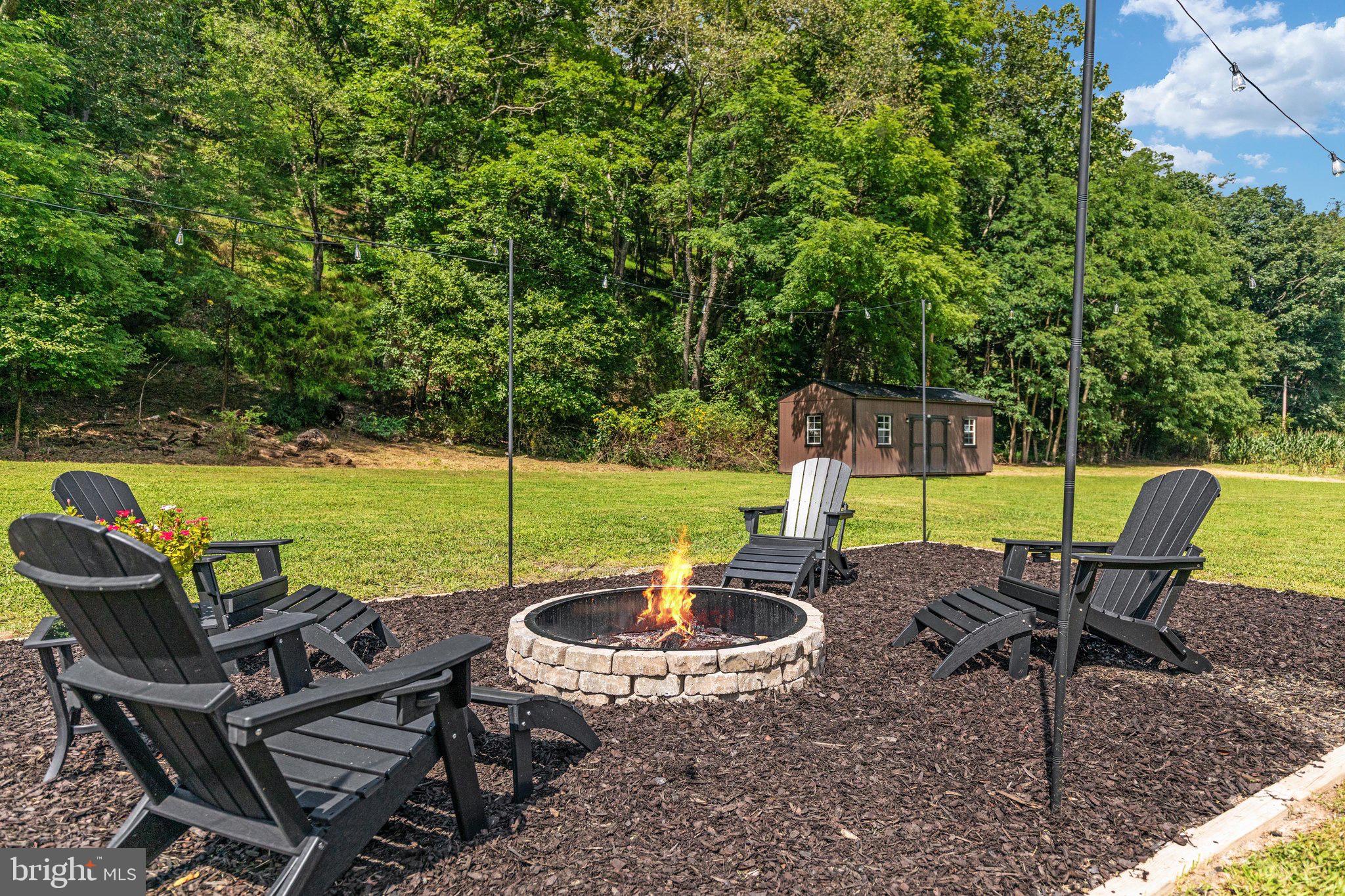 1396 Cullers Run Road Mathias, WV 26812 - Photo 52 of 79 Cozy fire pit surrounded by nature's embrace.