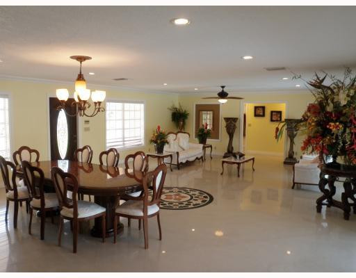 18361 Southwest 57th Street Southwest Ranches, FL 33331 - Photo 4 of 15 a view of a dining room with furniture and chandelier