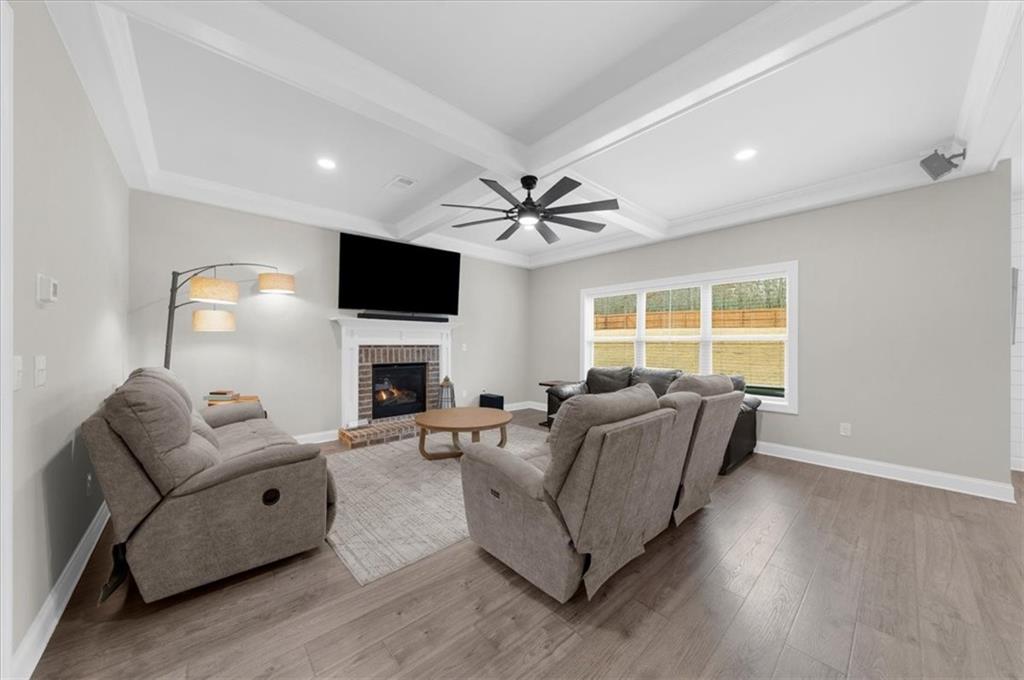 182 Bella Drive Monroe, GA 30655 - Photo 14 of 63 a living room with furniture fireplace and a flat screen tv