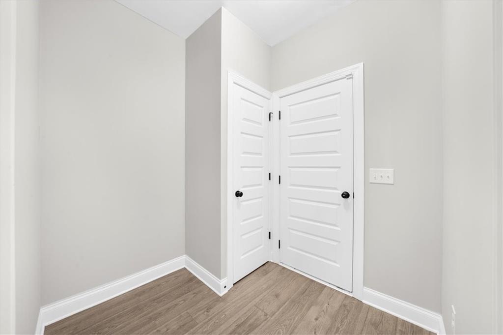 182 Bella Drive Monroe, GA 30655 - Photo 31 of 63 a view of walk in closet with empty racks