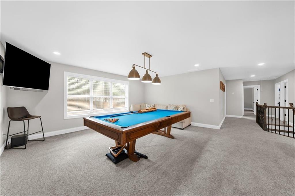 182 Bella Drive Monroe, GA 30655 - Photo 32 of 63 a living room with furniture pool table and a flat screen tv
