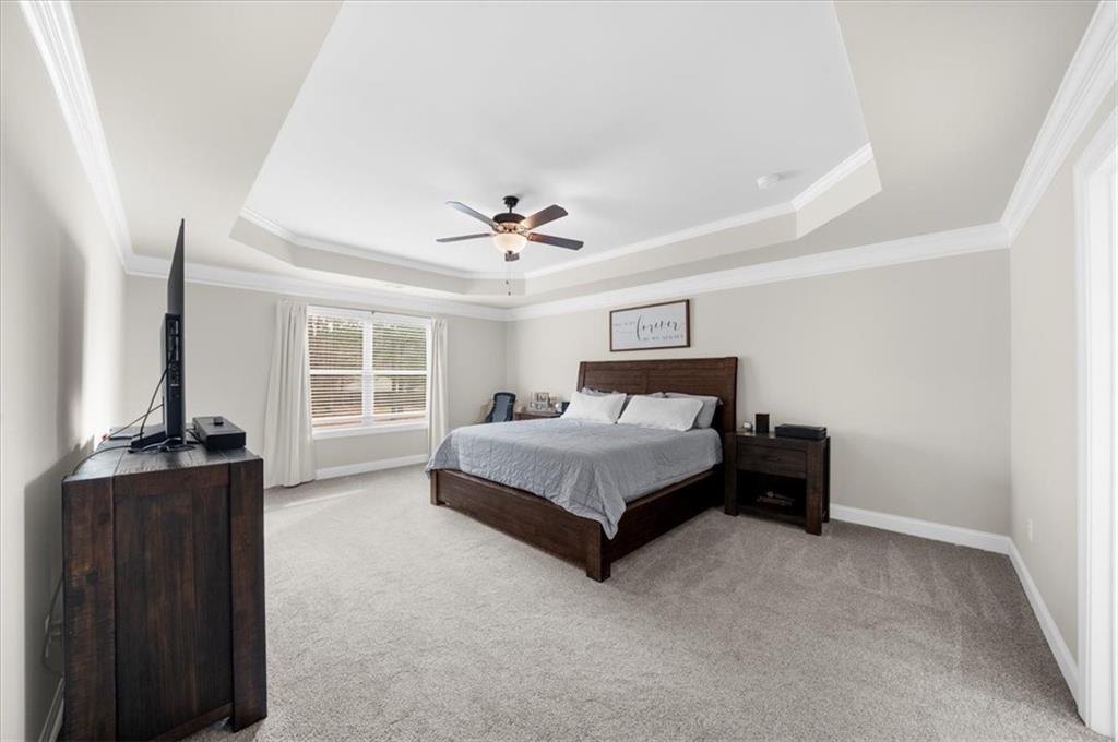 182 Bella Drive Monroe, GA 30655 - Photo 34 of 63 a bedroom with a bed and a desk