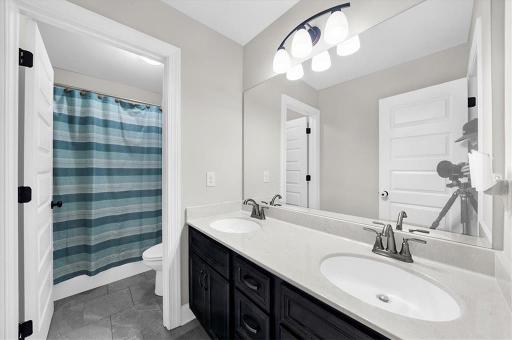 182 Bella Drive Monroe, GA 30655 - Photo 47 of 63 a bathroom with a double vanity sink mirror and double