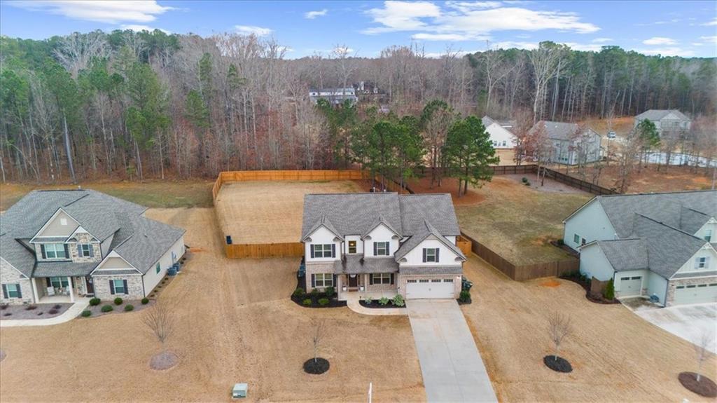 182 Bella Drive Monroe, GA 30655 - Photo 53 of 63 a view of a swimming pool with a patio