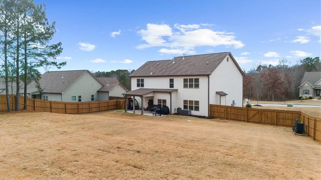 182 Bella Drive Monroe, GA 30655 - Photo 56 of 63 a view of a house with a patio