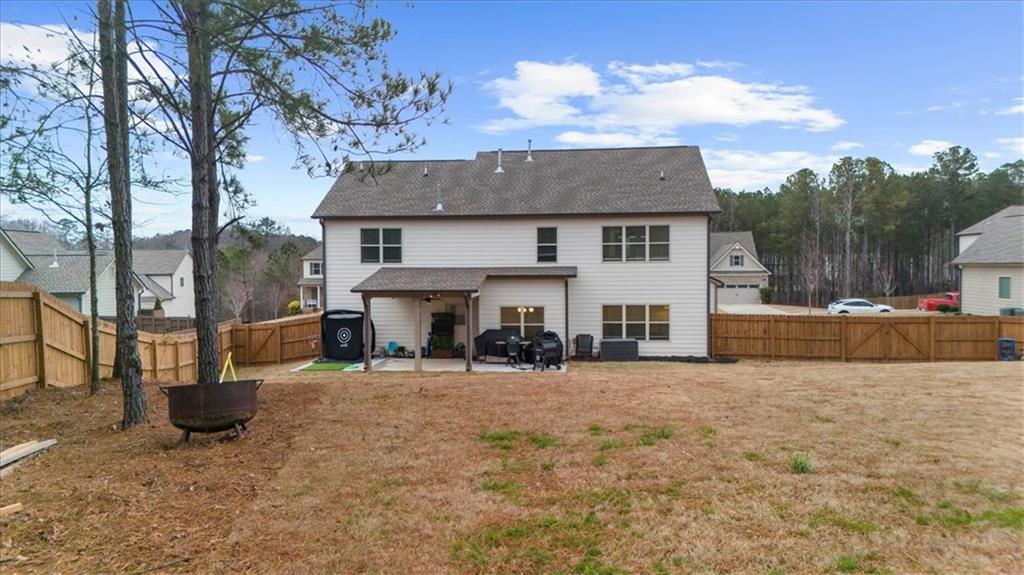 182 Bella Drive Monroe, GA 30655 - Photo 57 of 63 a view of a house with a yard and sitting area