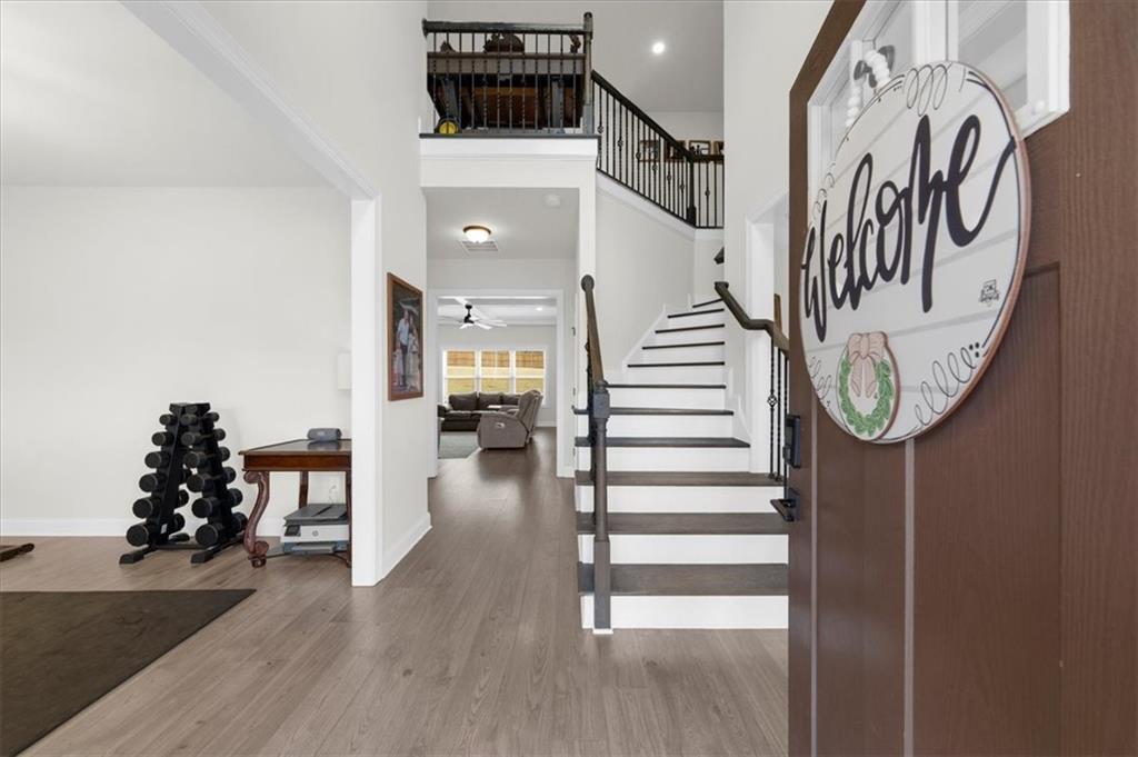 182 Bella Drive Monroe, GA 30655 - Photo 6 of 63 a view of entryway and hall with wooden floor