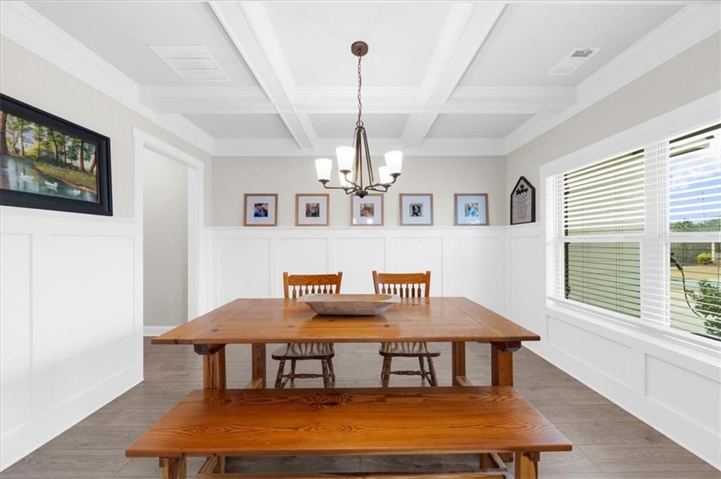 182 Bella Drive Monroe, GA 30655 - Photo 9 of 63 a view of a dining room with furniture window and wooden floor