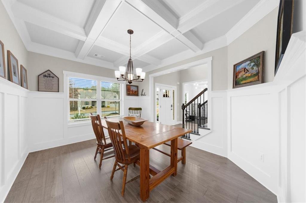182 Bella Drive Monroe, GA 30655 - Photo 10 of 63 a view of a dining room with furniture window and wooden floor