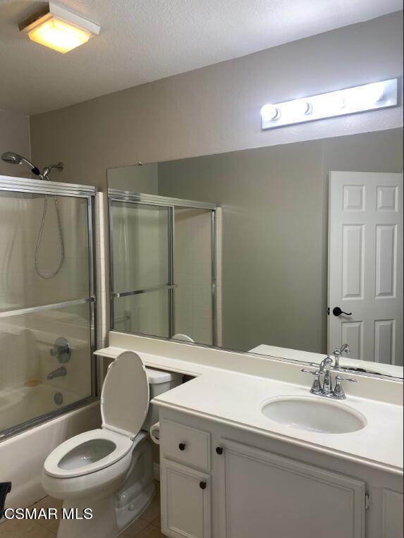 2753 Titania Place Simi Valley, CA 93063 - Photo 13 of 14 a bathroom with a toilet a sink and mirror