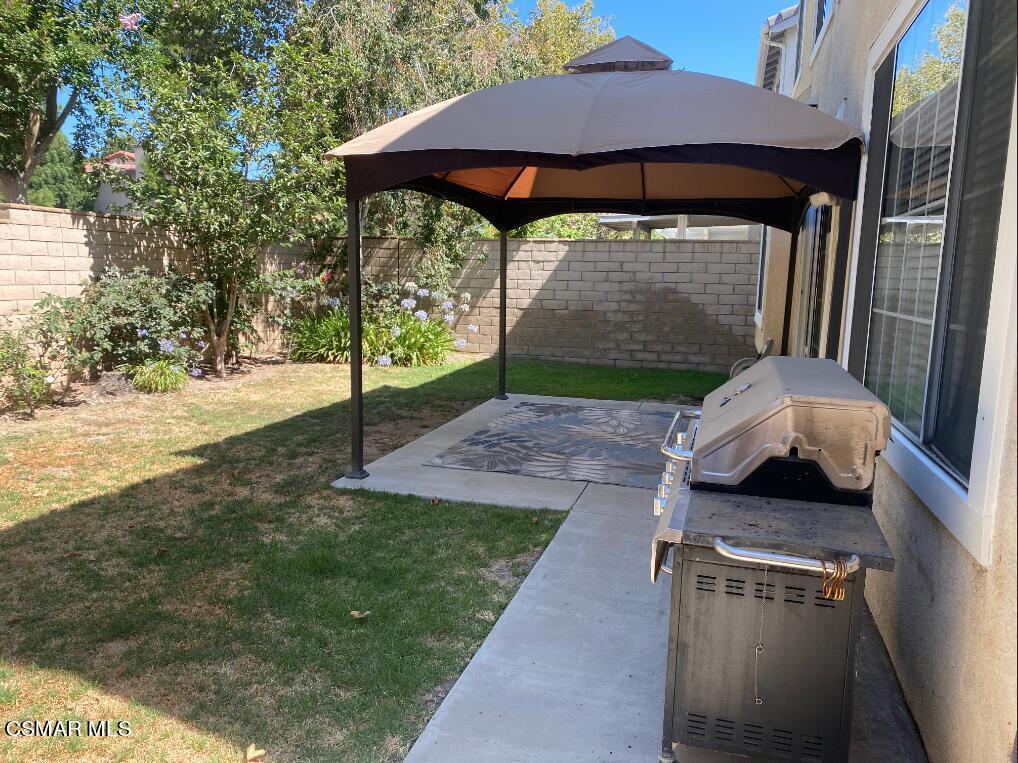 2753 Titania Place Simi Valley, CA 93063 - Photo 14 of 14 a backyard of a house with seating space