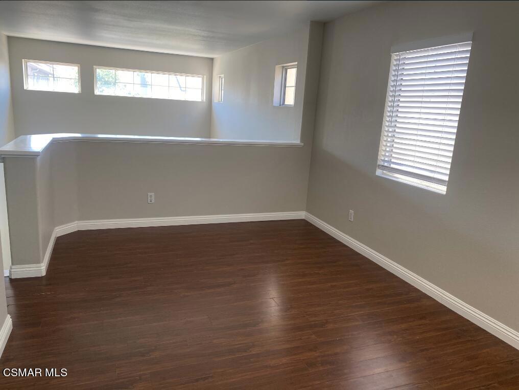 2753 Titania Place Simi Valley, CA 93063 - Photo 8 of 14 a view of wooden floor and windows in an empty room