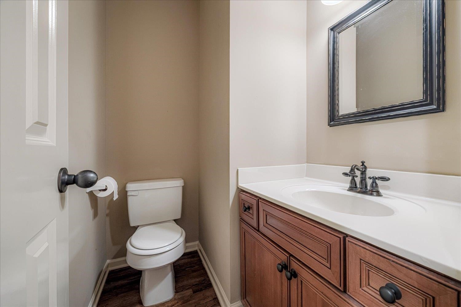 4597 Whisper Spring Drive Collierville, TN 38017 - Photo 33 of 39 a bathroom with a toilet a sink and mirror