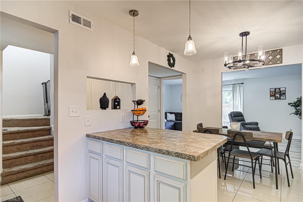 2215 Shadow Valley Road, Unit B High Point, NC 27265 - Photo 13 of 33 Kitchen island keeps you organized. Just add a stool and it is perfect when eating a quick meal!