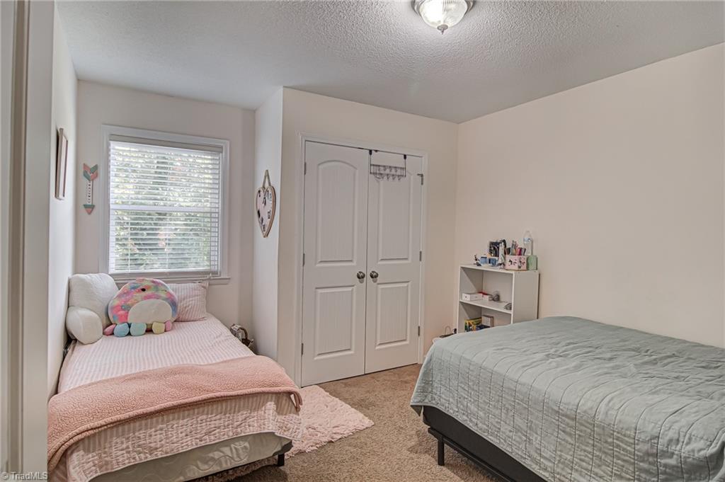 2215 Shadow Valley Road, Unit B High Point, NC 27265 - Photo 23 of 33 Second bedroom also features double door closet and window that provides plenty of natural light!