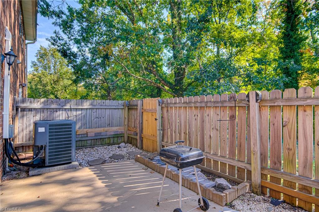 2215 Shadow Valley Road, Unit B High Point, NC 27265 - Photo 28 of 33 Wonderful rear patio with privacy fence - perfect area for barbeques or just simply enjoying the NC weather.