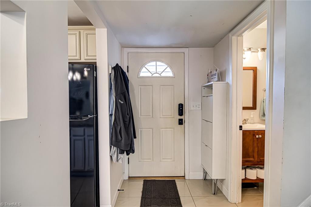 2215 Shadow Valley Road, Unit B High Point, NC 27265 - Photo 3 of 33 As you enter the home, you will be greeted by foyer hallway that leads to living room. Doorway to the right leads to half bathroom. Doorway to the left opens up to kitchen and dining area.