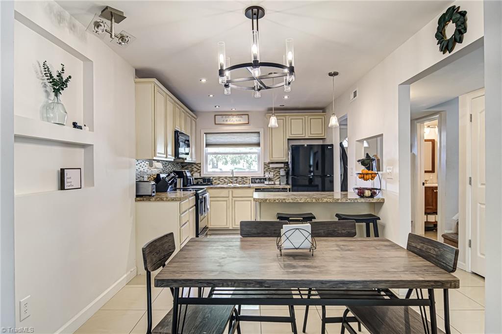 2215 Shadow Valley Road, Unit B High Point, NC 27265 - Photo 9 of 33 Dining area is beside the kitchen - make meal preparation a breeze!