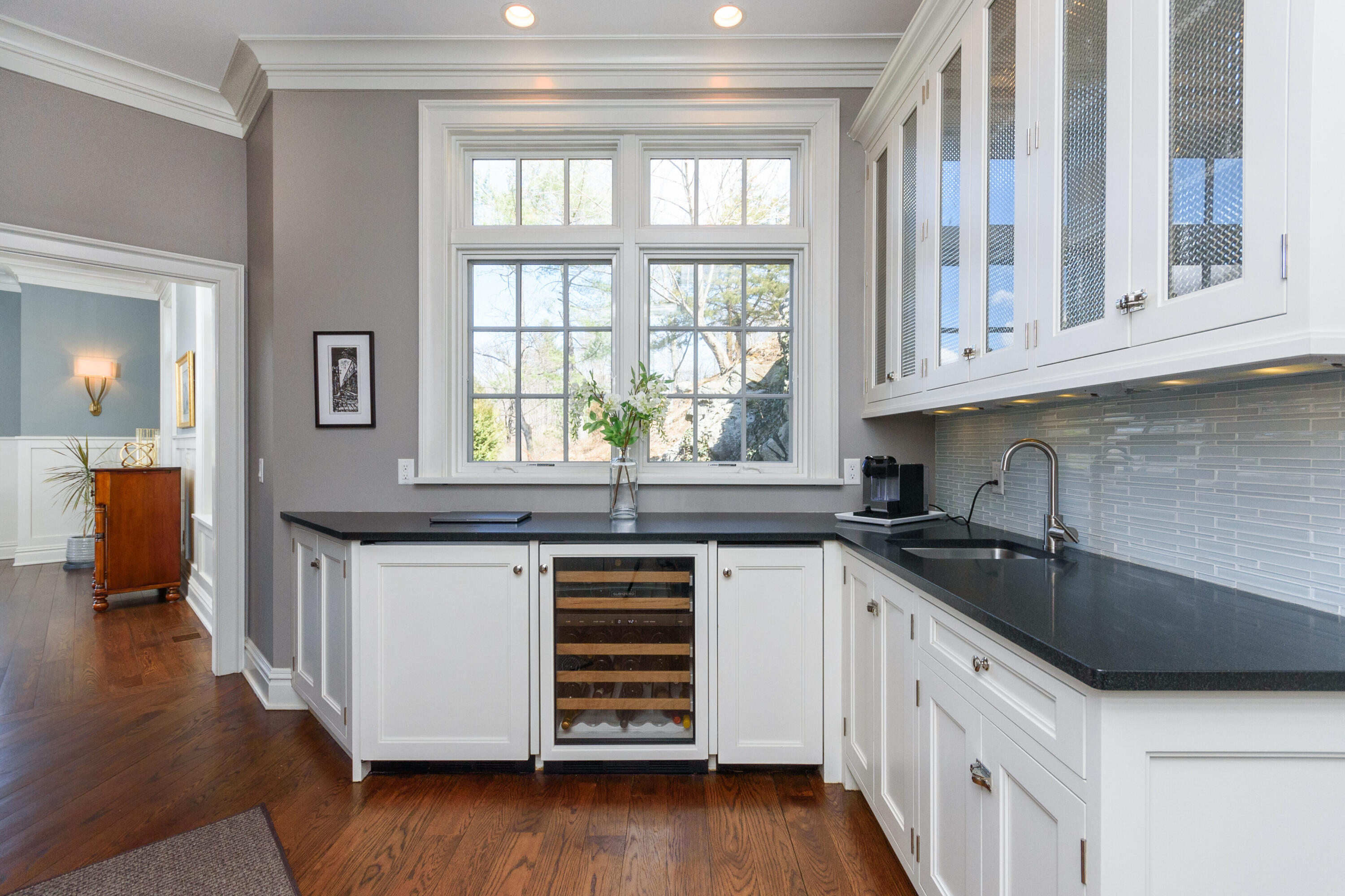 80 Goodwives River Road Darien, CT 06820 - Photo 20 of 57 a kitchen with stainless steel appliances granite countertop a sink and dishwasher a stove with wooden floor