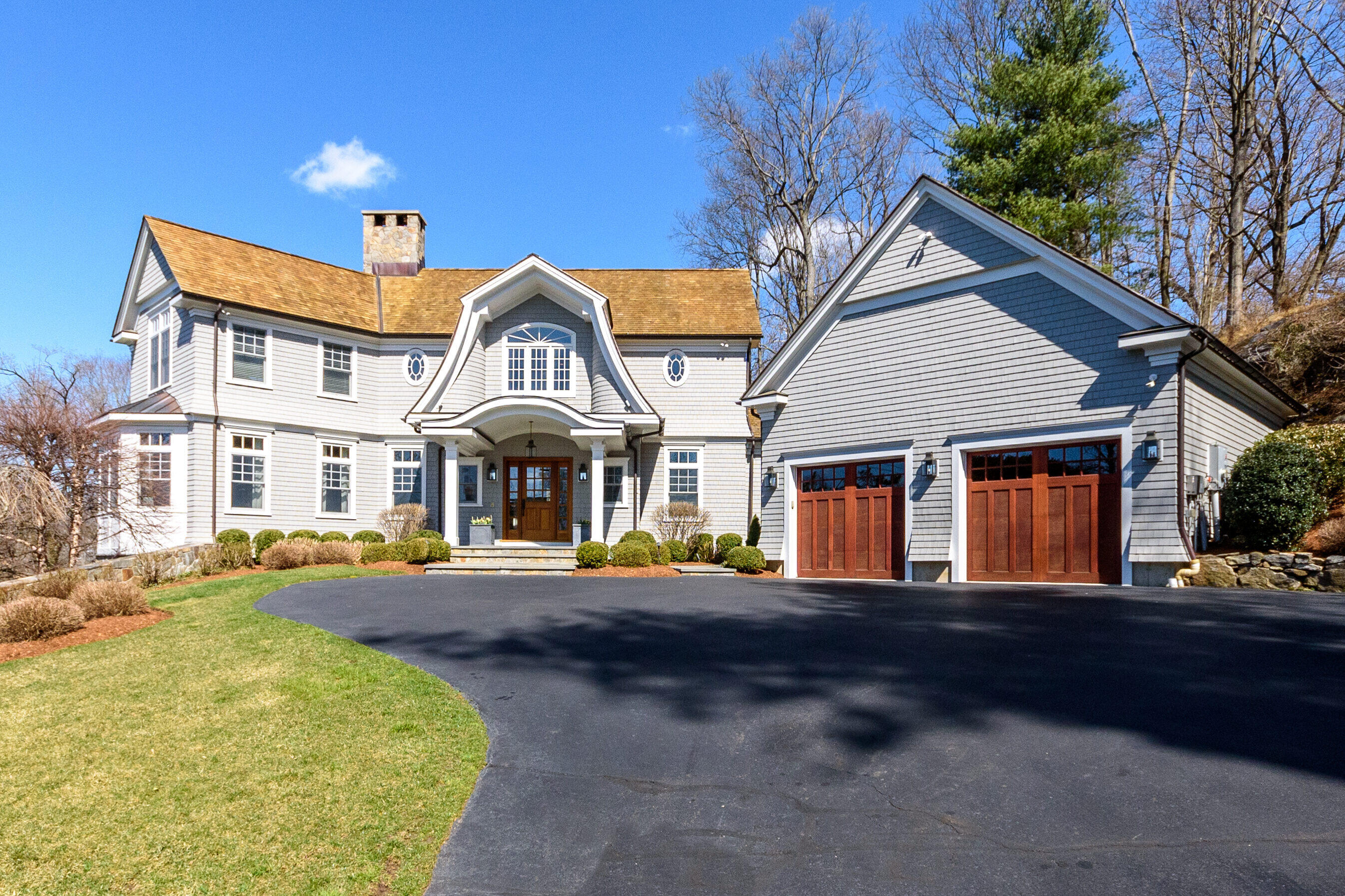 80 Goodwives River Road Darien, CT 06820 - Photo 2 of 57 a front view of a house with a yard