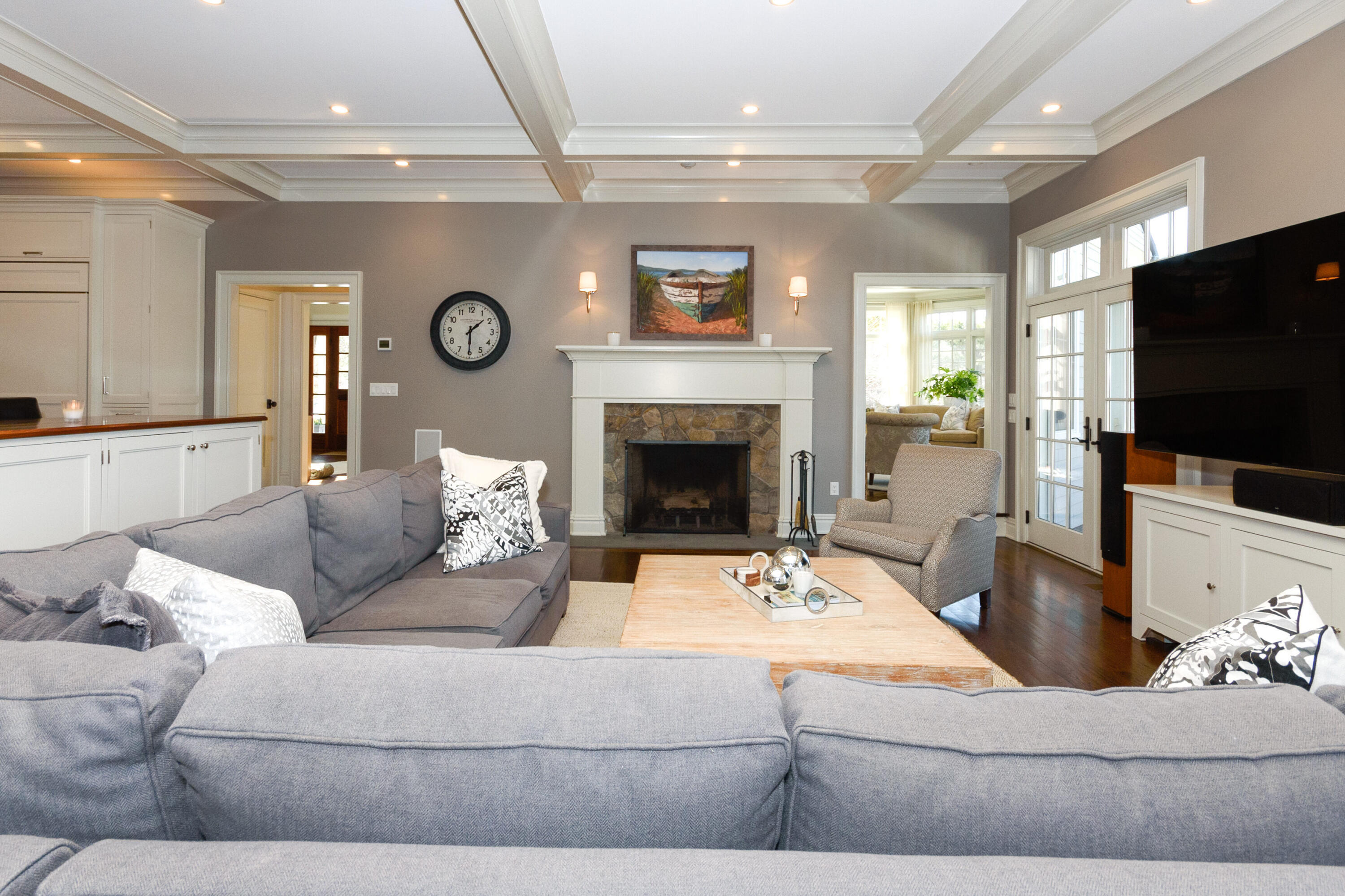 80 Goodwives River Road Darien, CT 06820 - Photo 23 of 57 a living room with furniture a fireplace and a flat screen tv