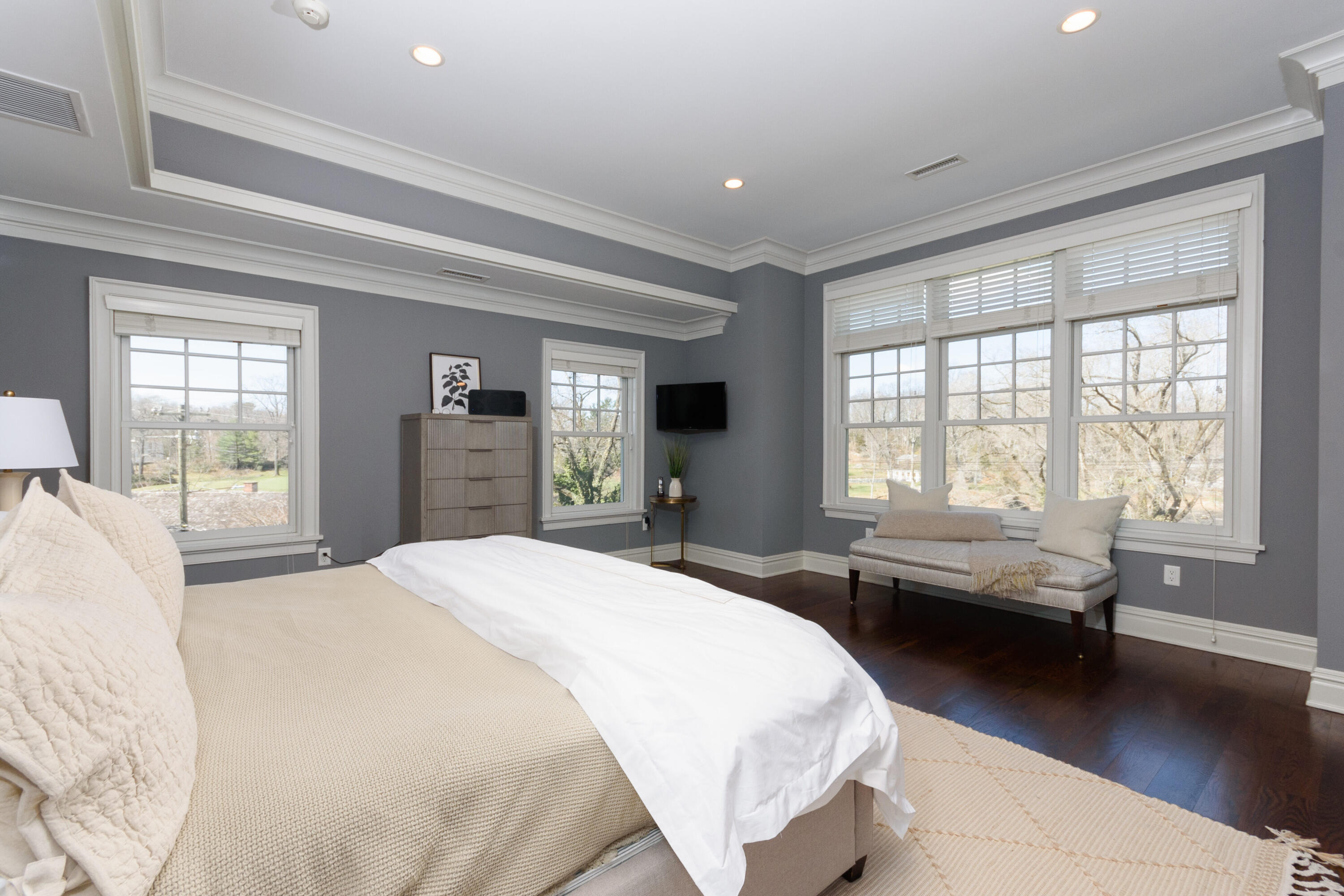 80 Goodwives River Road Darien, CT 06820 - Photo 27 of 57 a spacious bedroom with a bed and wooden floor