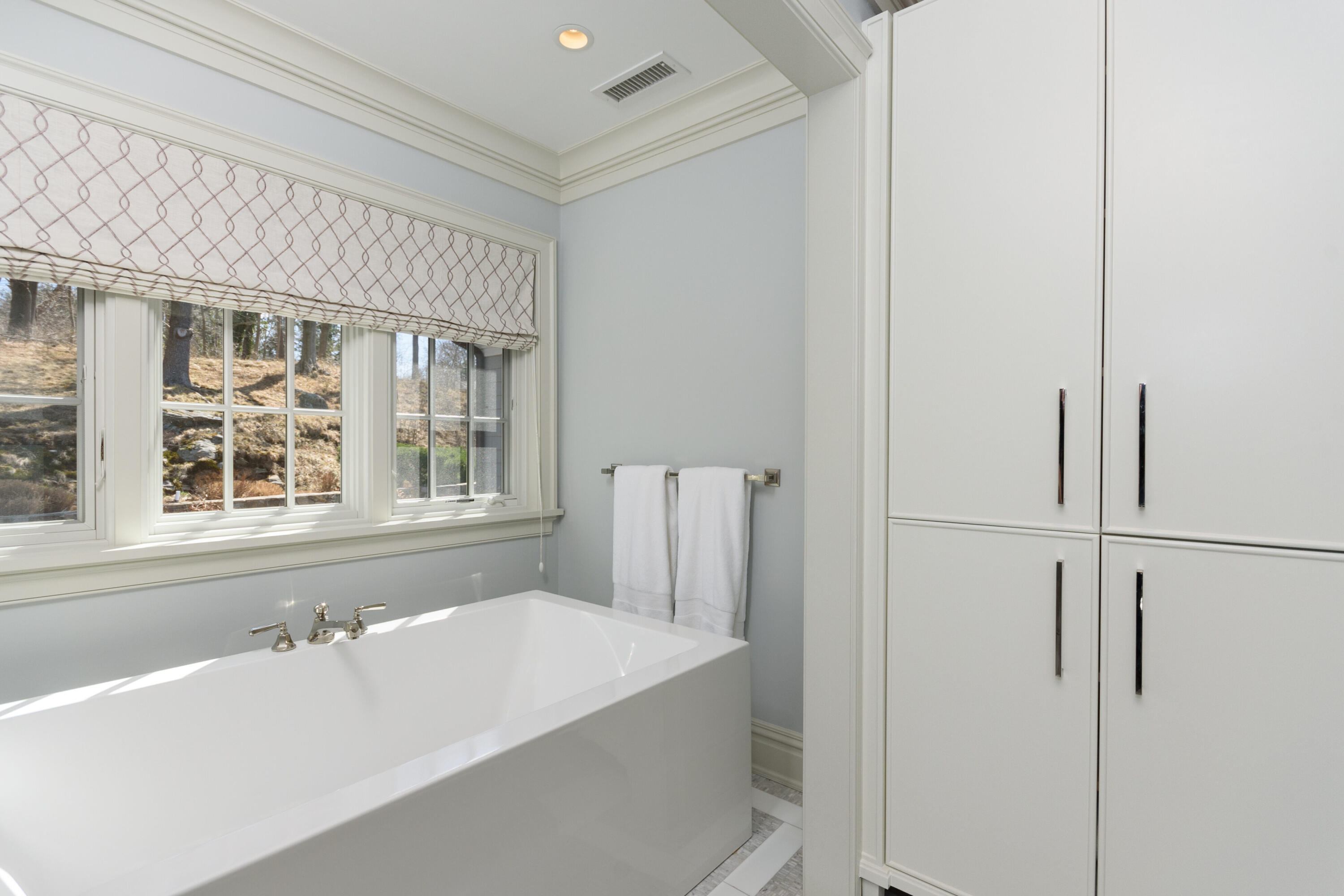 80 Goodwives River Road Darien, CT 06820 - Photo 30 of 57 a bathroom with a bathtub and a window