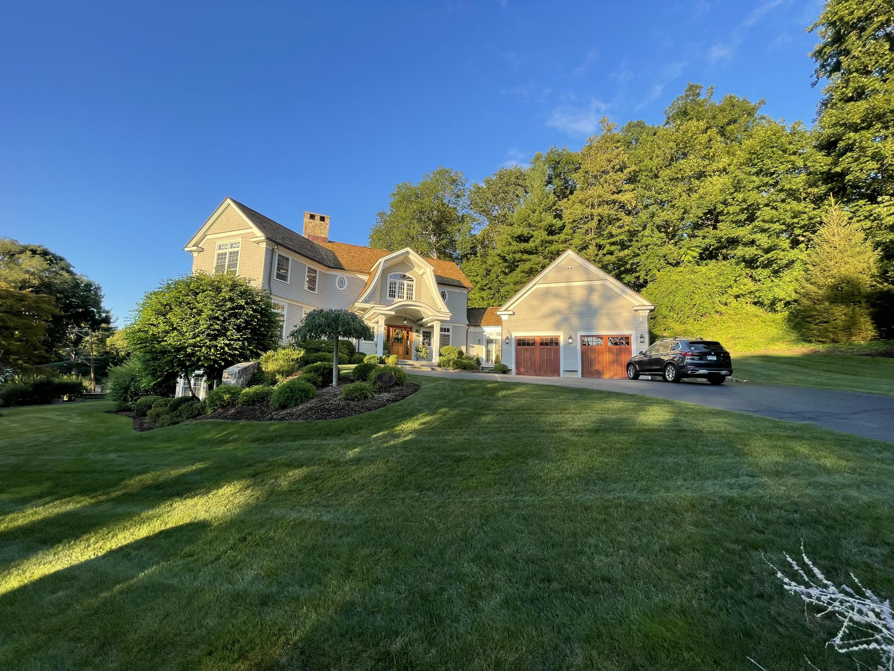 80 Goodwives River Road Darien, CT 06820 - Photo 3 of 57 a front view of a house with garden