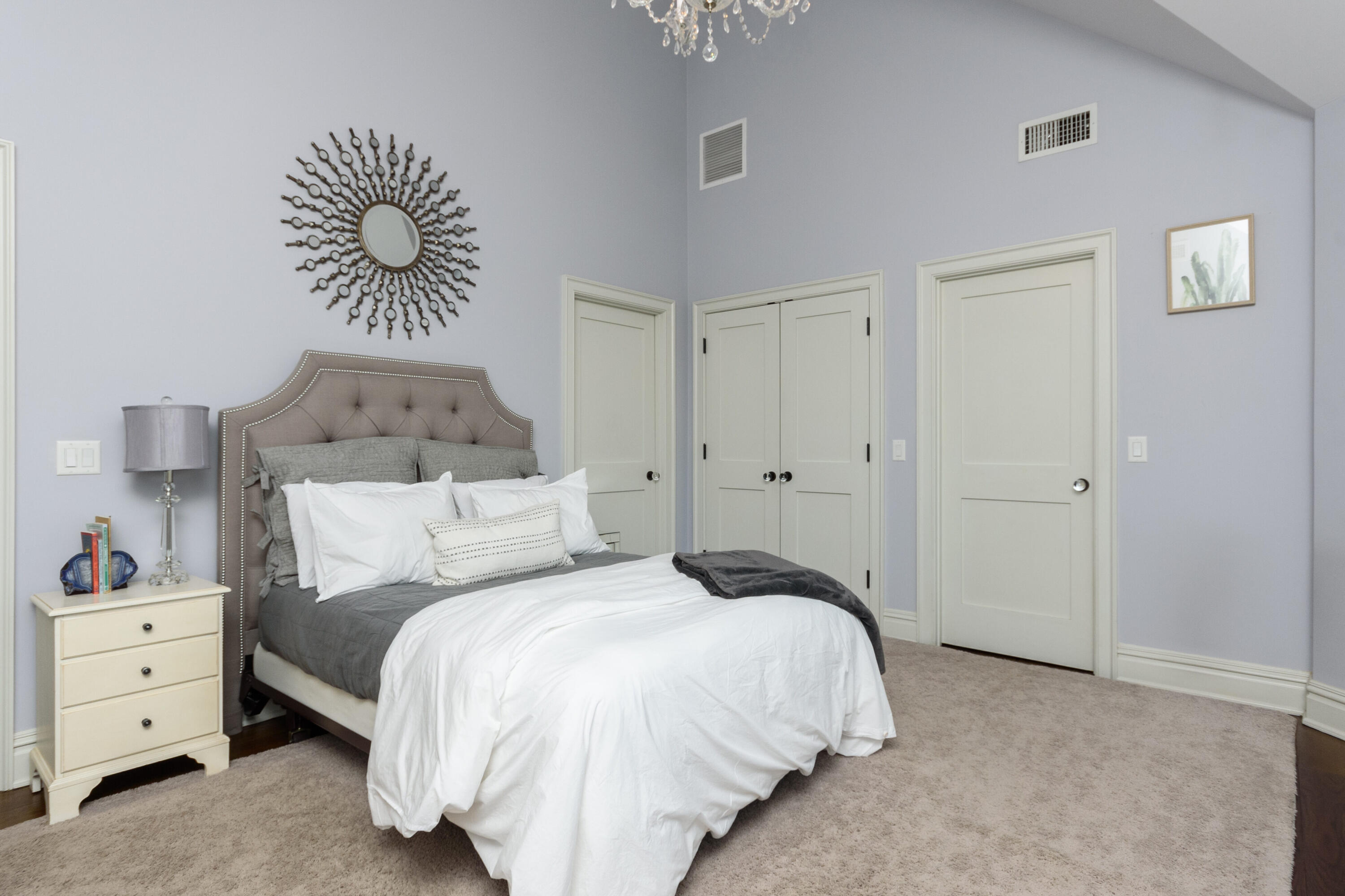 80 Goodwives River Road Darien, CT 06820 - Photo 33 of 57 a bedroom with a bed and a chandelier