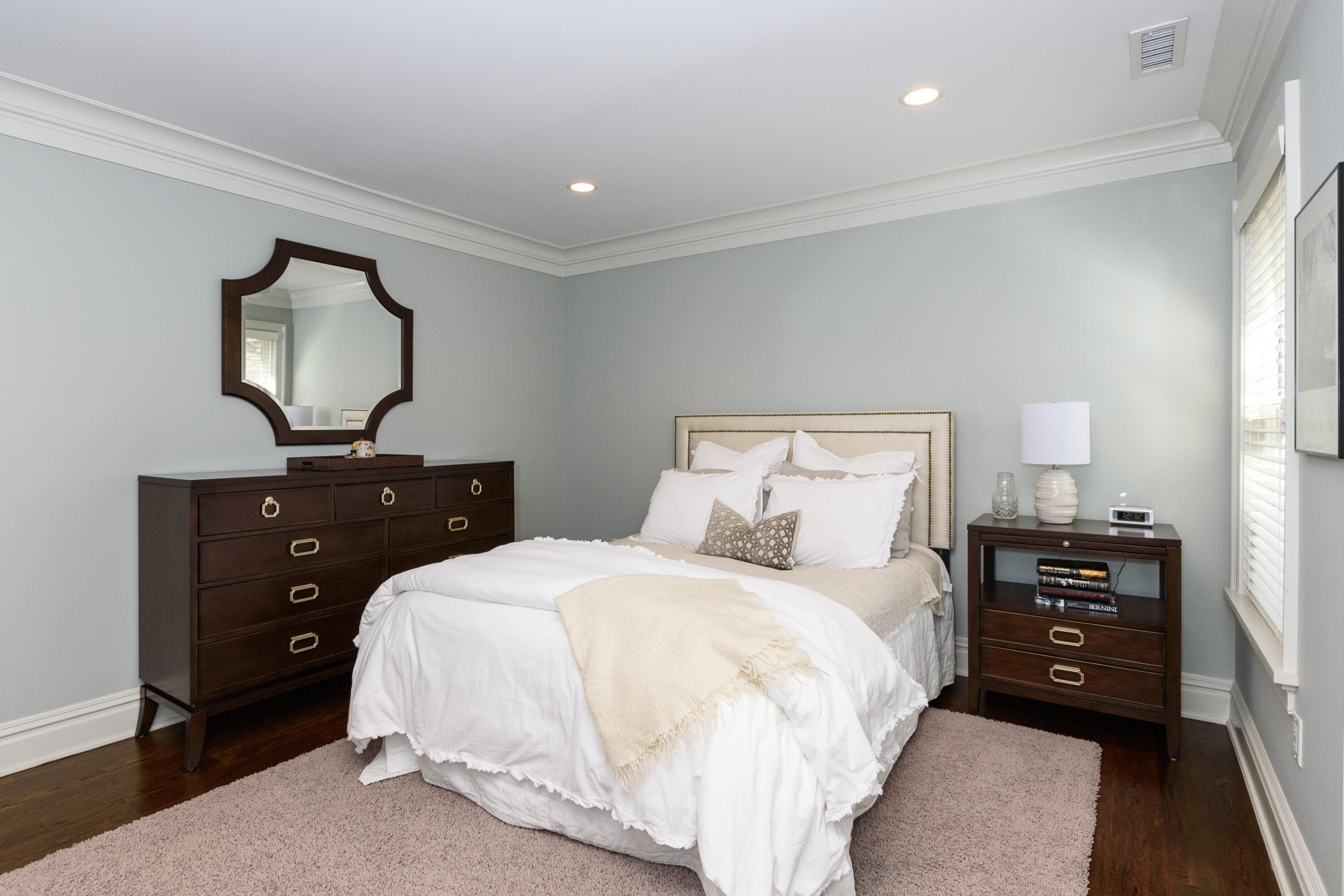 80 Goodwives River Road Darien, CT 06820 - Photo 37 of 57 a bedroom with a bed and a mirror