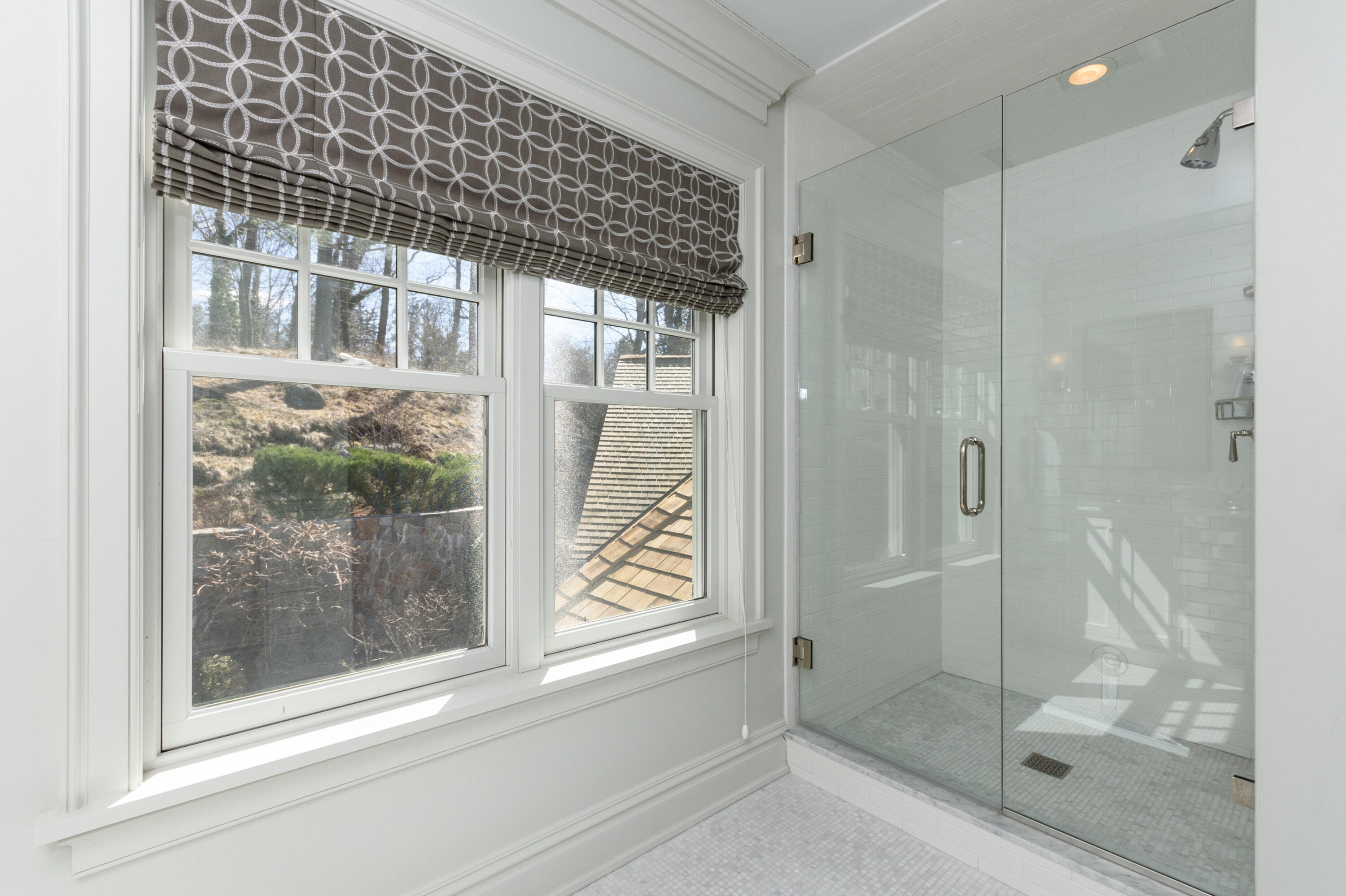 80 Goodwives River Road Darien, CT 06820 - Photo 40 of 57 a bathroom with a glass shower door and a window
