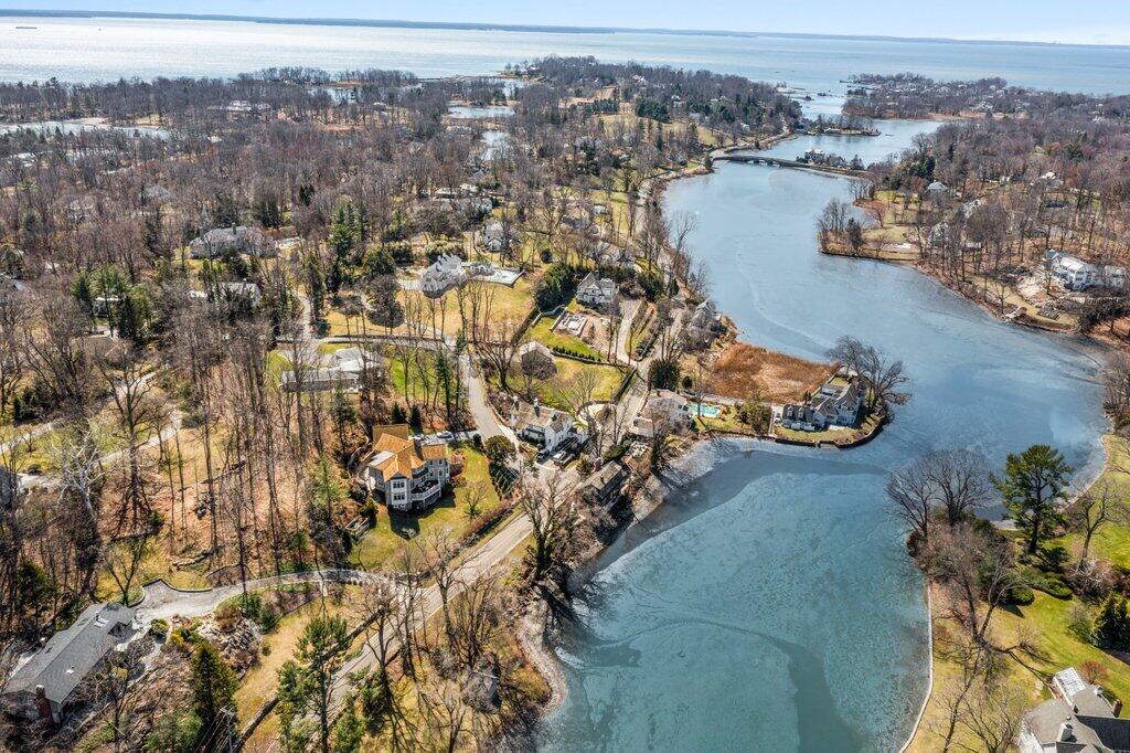 80 Goodwives River Road Darien, CT 06820 - Photo 4 of 57 an aerial view of lake and residential houses with outdoor space