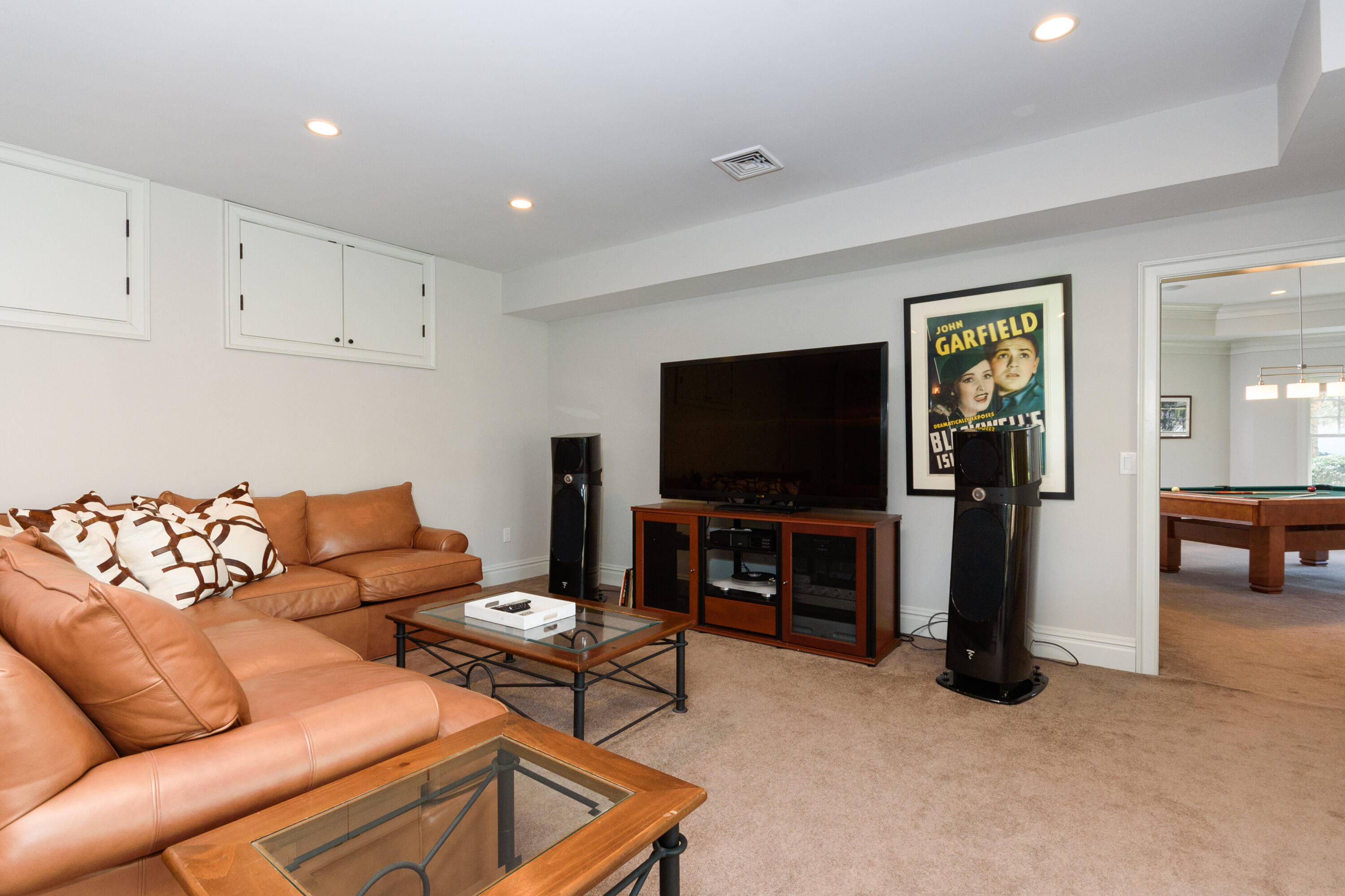 80 Goodwives River Road Darien, CT 06820 - Photo 44 of 57 a living room with furniture and a flat screen tv