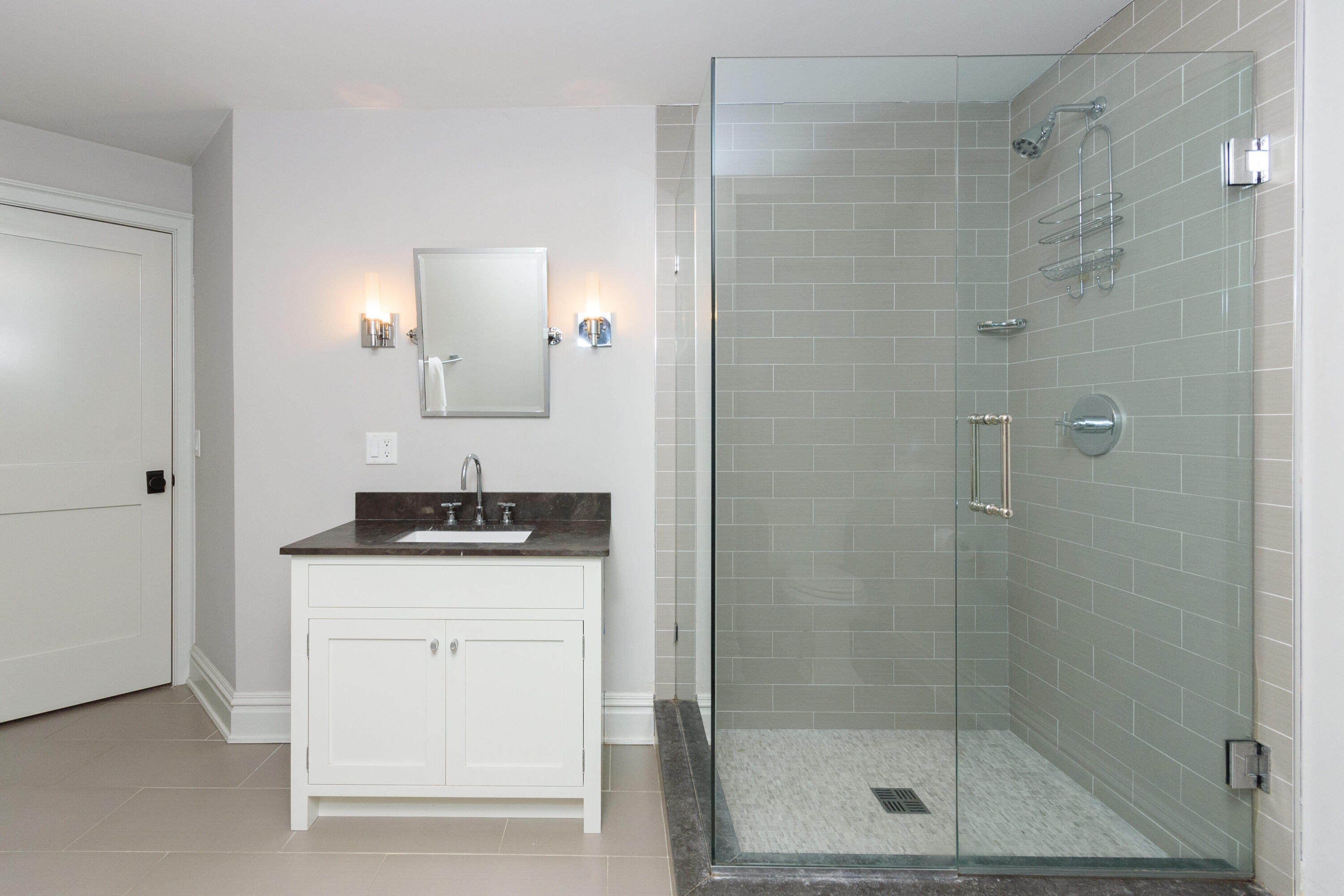 80 Goodwives River Road Darien, CT 06820 - Photo 47 of 57 a bathroom with a granite countertop sink a shower and a mirror