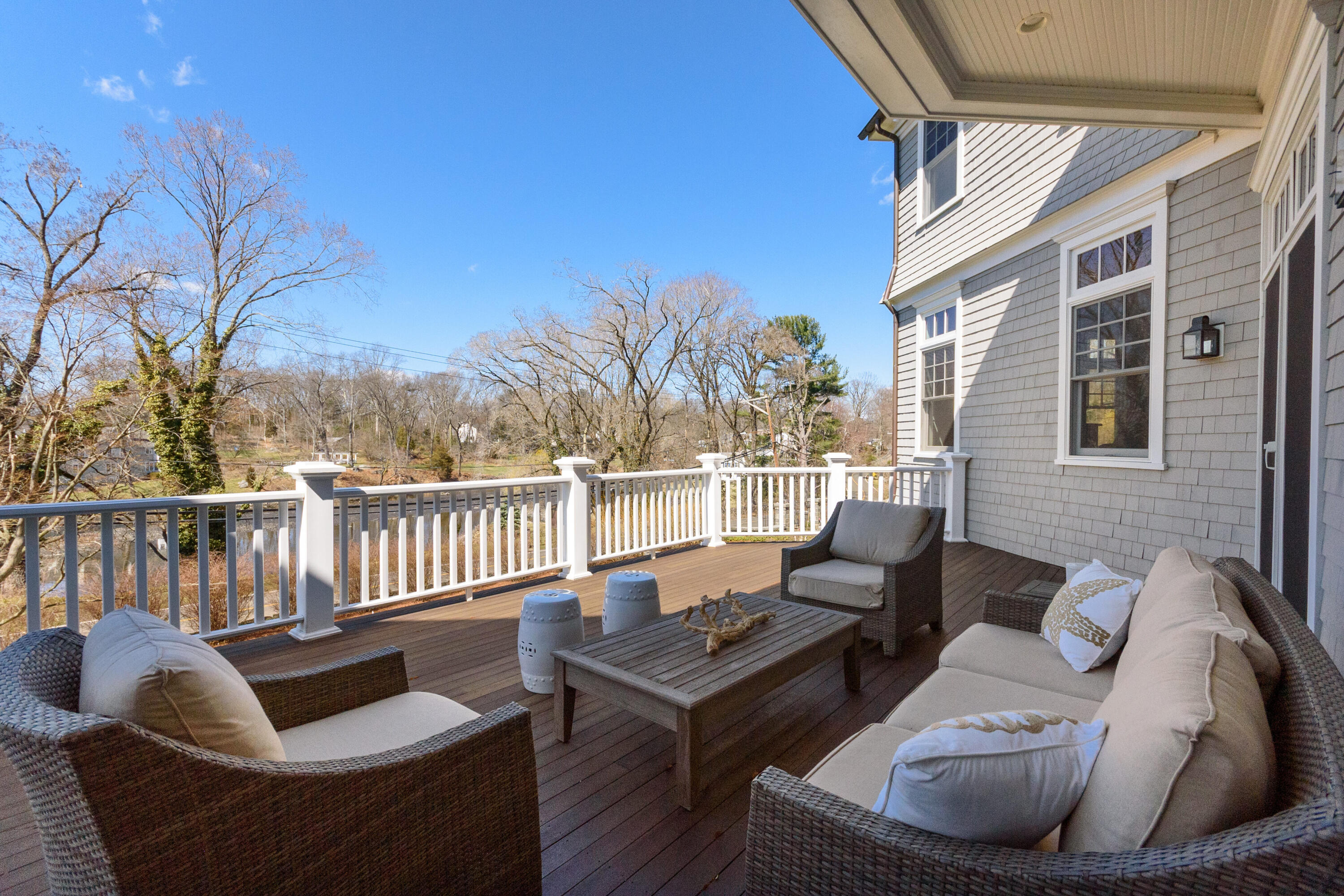 80 Goodwives River Road Darien, CT 06820 - Photo 48 of 57 a roof deck with couches and wooden floor