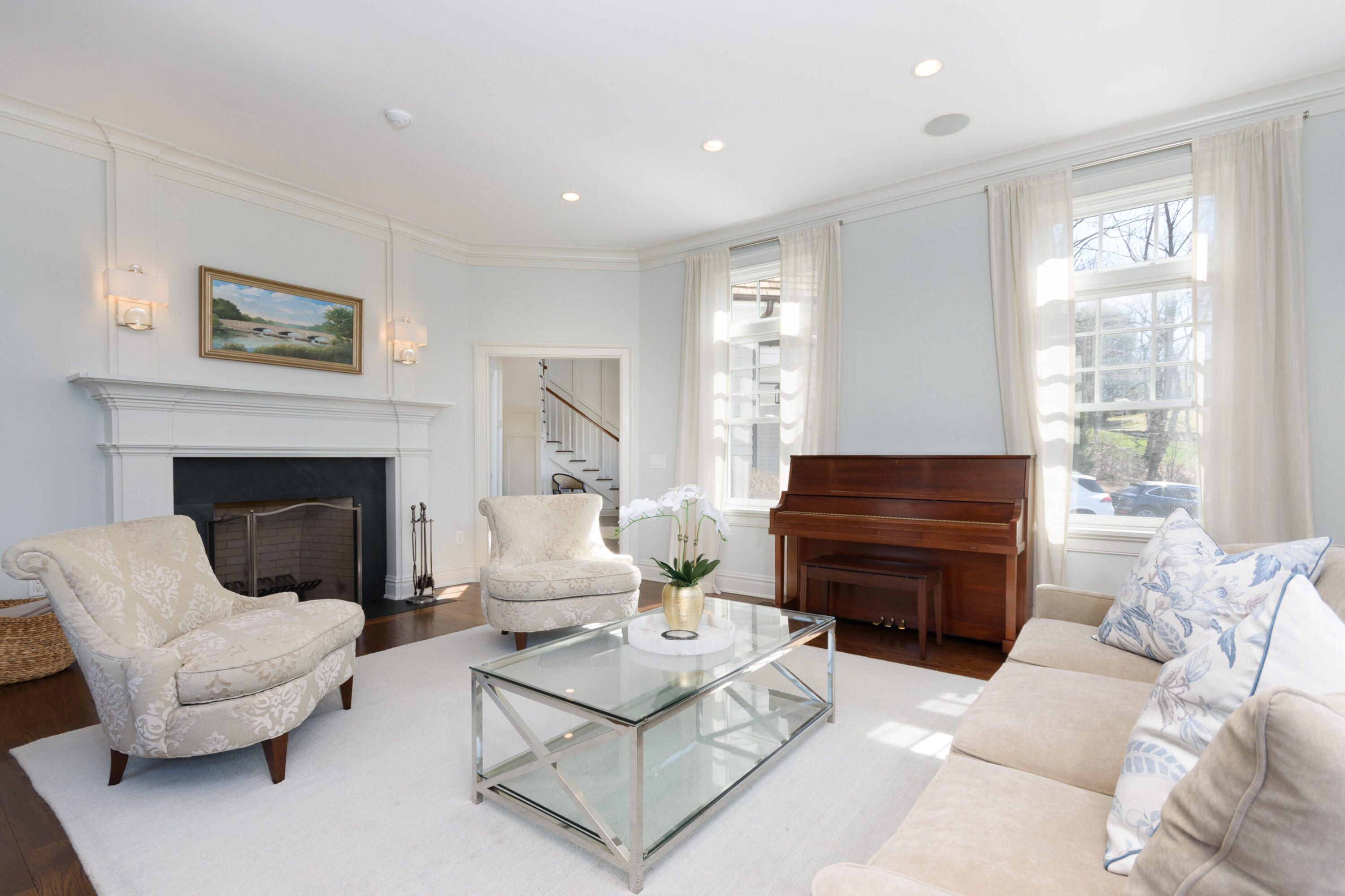 80 Goodwives River Road Darien, CT 06820 - Photo 10 of 57 a living room with furniture a large window and a fireplace