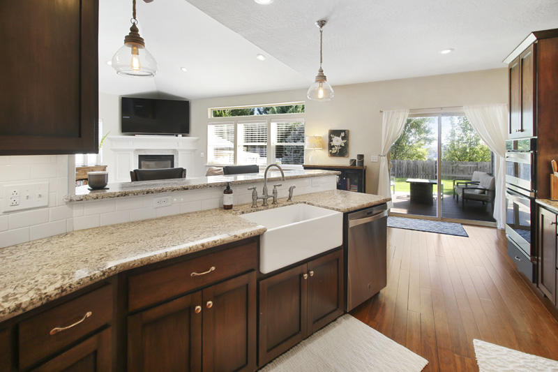 893 Ridgeview Drive Eagle Point, OR 97524 - Photo 11 of 49 a large kitchen with kitchen island granite countertop a sink counter space appliances and a large window