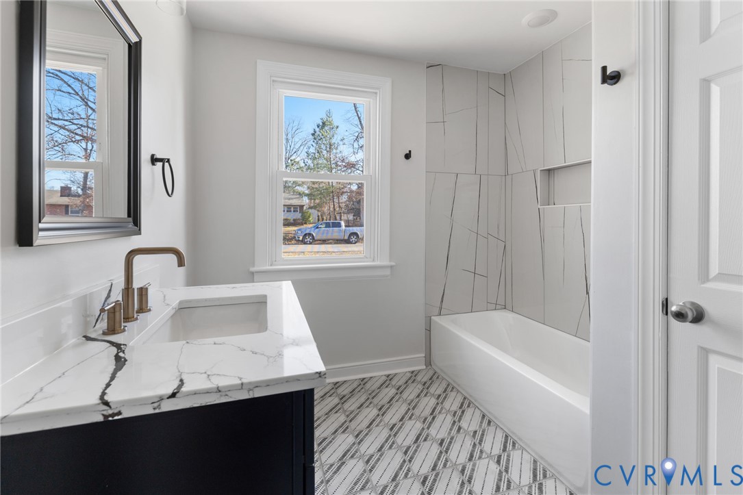 2002 Milbank Road Henrico, VA 23229 - Photo 12 of 23 a bathroom with a sink and a bathtub