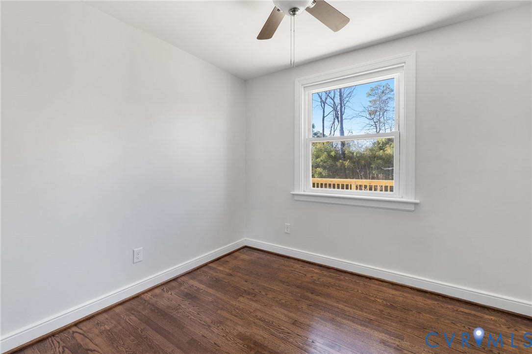 2002 Milbank Road Henrico, VA 23229 - Photo 14 of 23 an empty room with wooden floor and windows