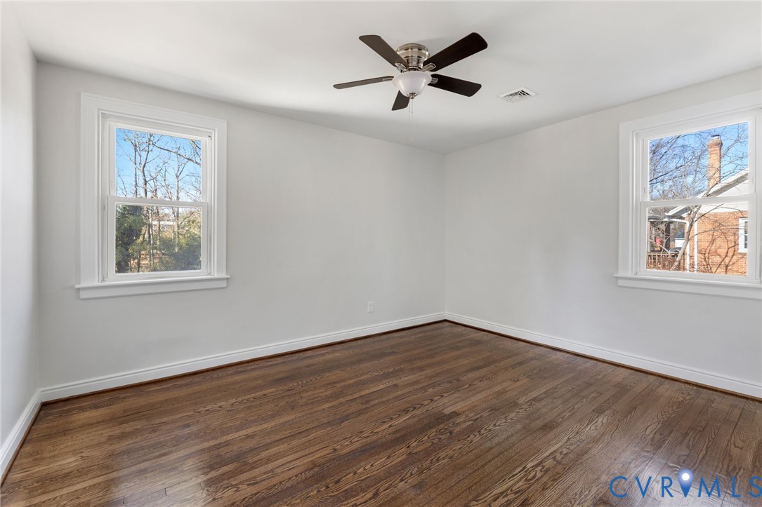 2002 Milbank Road Henrico, VA 23229 - Photo 16 of 23 a view of empty room with wooden floor and window