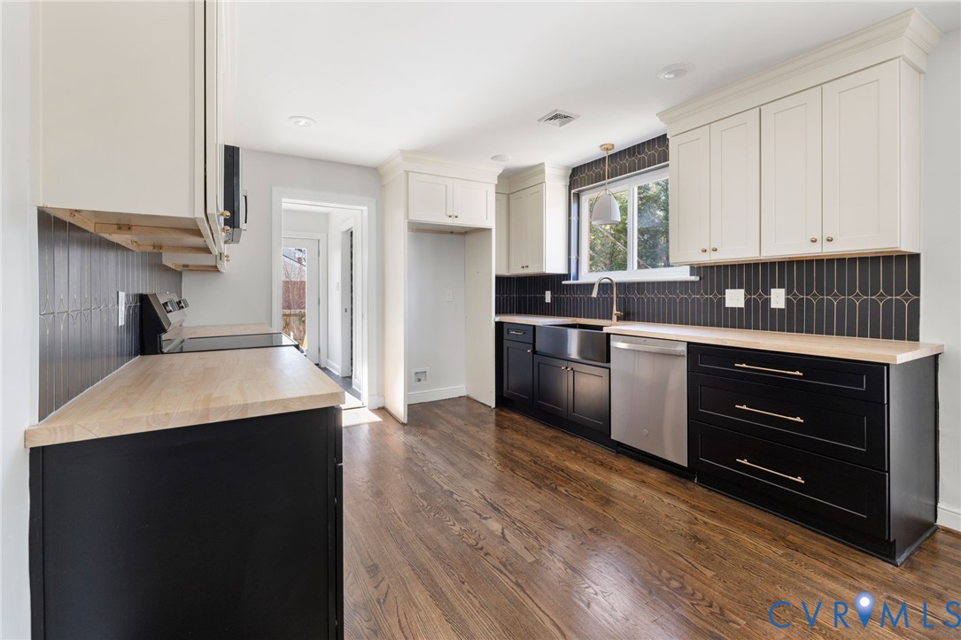 2002 Milbank Road Henrico, VA 23229 - Photo 6 of 23 a kitchen with stainless steel appliances granite countertop a sink stove and refrigerator
