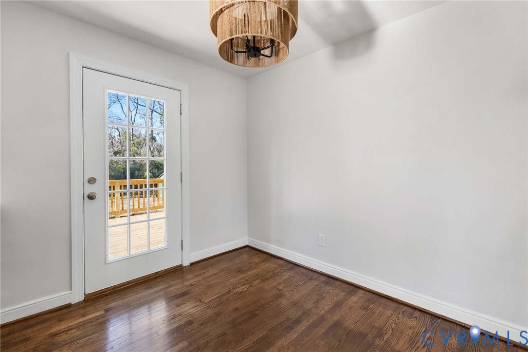 2002 Milbank Road Henrico, VA 23229 - Photo 7 of 23 a view of a small space with wooden floor and a window