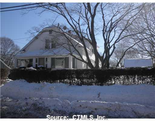 4 Tierney Street Norwalk, CT 06851 - Photo 1 of 1 a front view of a house with a yard