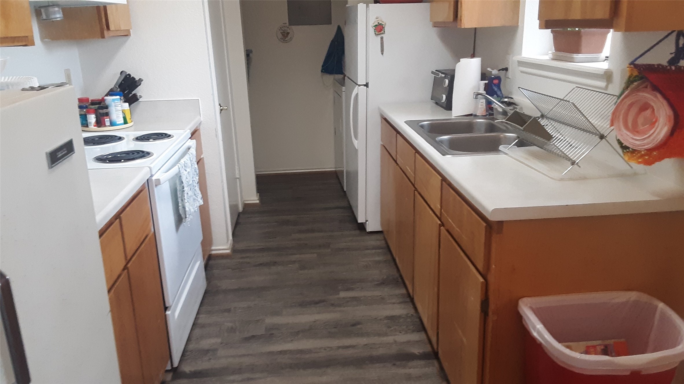 303 E Avenue Hooks, TX 75561 - Photo 14 of 19 a kitchen with a sink a stove and cabinets