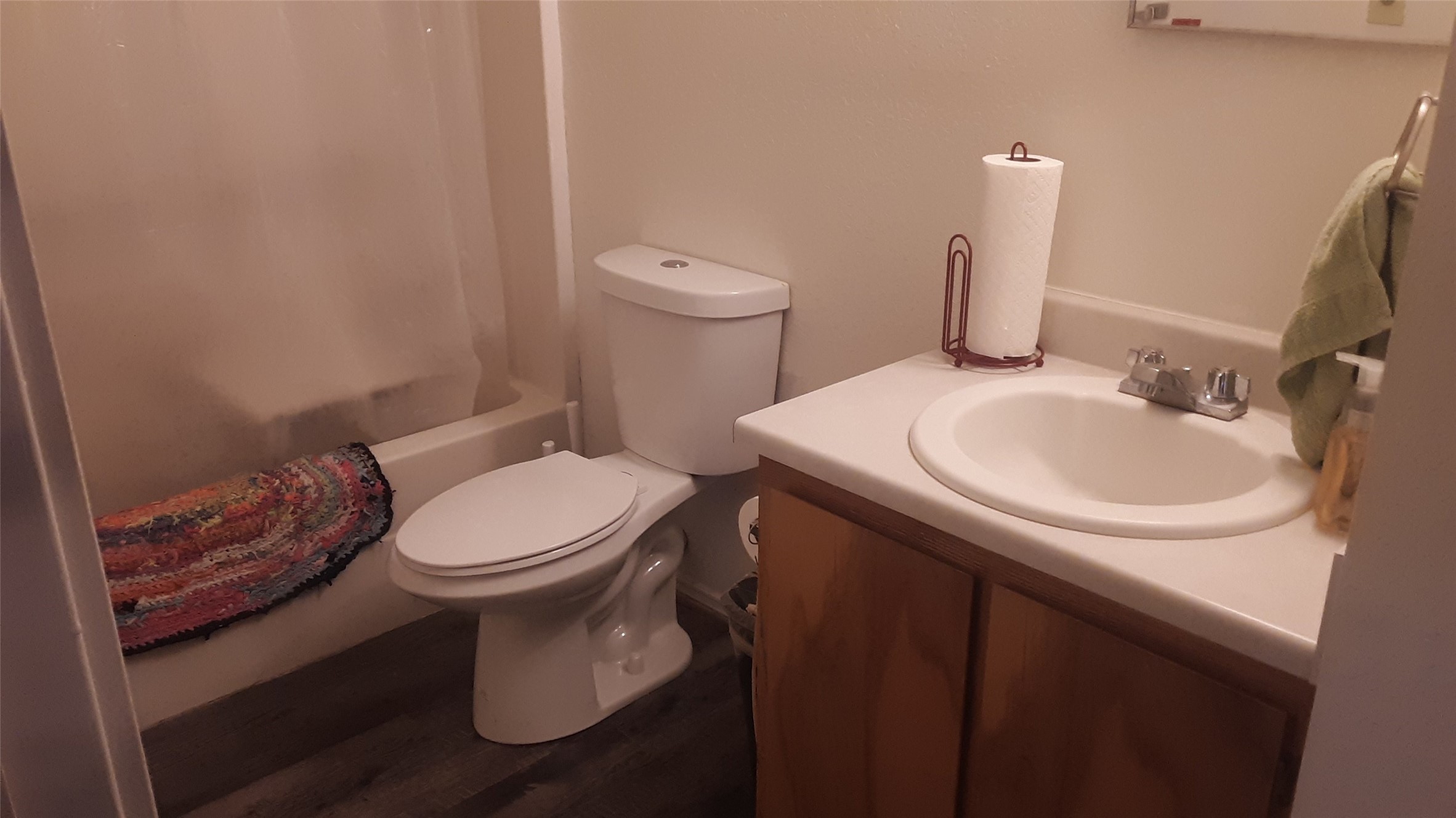 303 E Avenue Hooks, TX 75561 - Photo 15 of 19 a white toilet sitting next to a bathroom sink